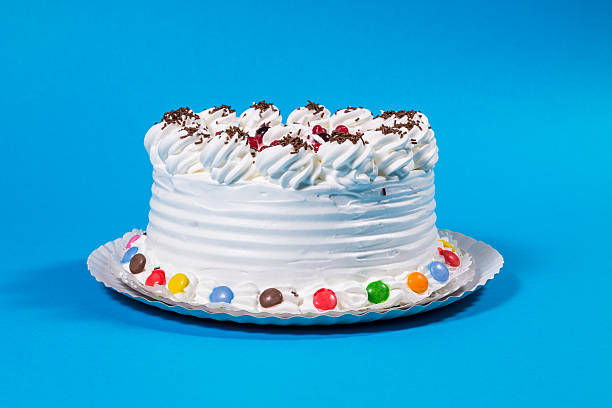 istock Tasty creamy birthday cake colorful candy adorned 497839896