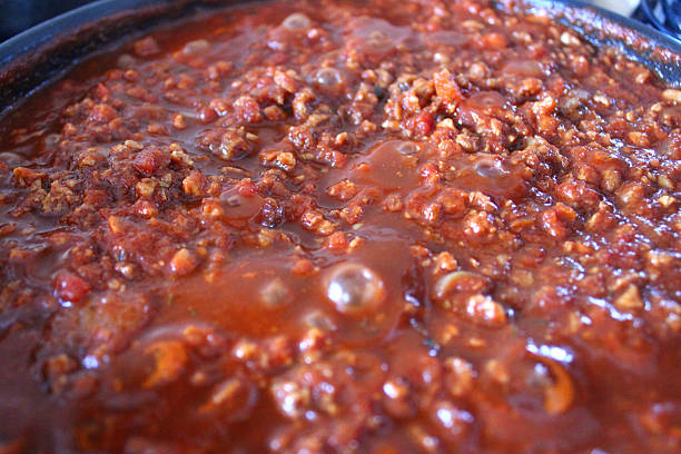 istock Bolognese sauce simmering on cooker, beef mince, pasta sauce image 497848855