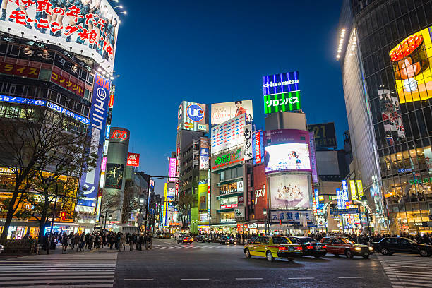istock Japan colourful neon signs overlooking traffic crowded streets 497852431