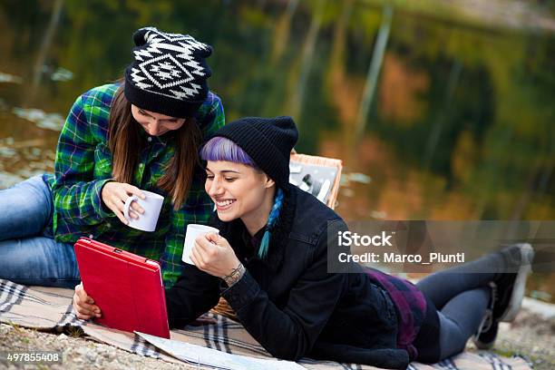 Two Beautiful Girl Relax In The Mountain Stock Photo - Download Image Now - 2015, Adventure, Cafe