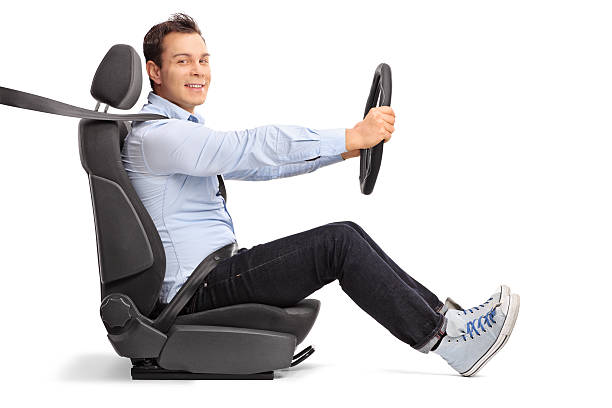 istock Young man driving seated on car seat 497856088