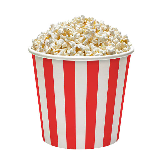 Popcorn in bucket Popcorn in striped bucket isolated on white background bucket stock pictures, royalty-free photos & images