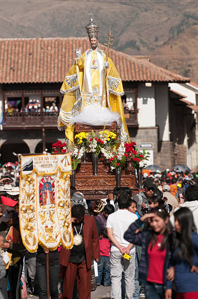Cusco, Peru - June 23, 2011: Local believers celebrate Corpus Christi festival in the old city main square. For believers, the festival represents fifteen saints and virgins, organised in several processions, arriving from different places to the Cathedral of Cusco in order to “greet” the body of Christ, sixty days after Easter Sunday.
