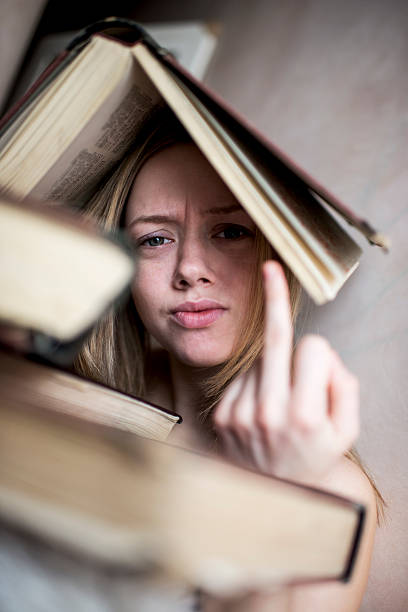istock Rude woman with a book on her head. 497858582