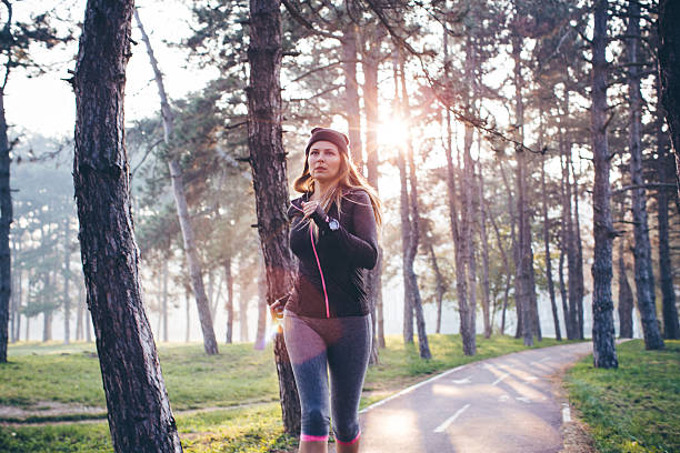istock Woman running in forest 497858646