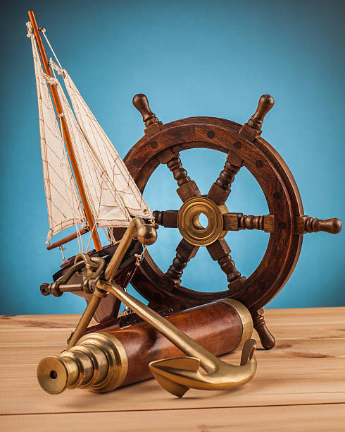 istock maritime adventure old anchor and old telescope 497859804