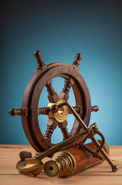 istock maritime adventure old wooden steering wheel 497860326
