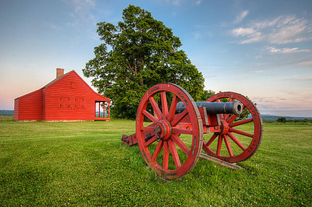 A cannon on display with the Neilson Farm in the background at Saratoga National Battlefield near Stillwater, NY. 