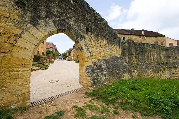 Part of the old citywall with gate of the ancient village domme in the Dordogne area in France