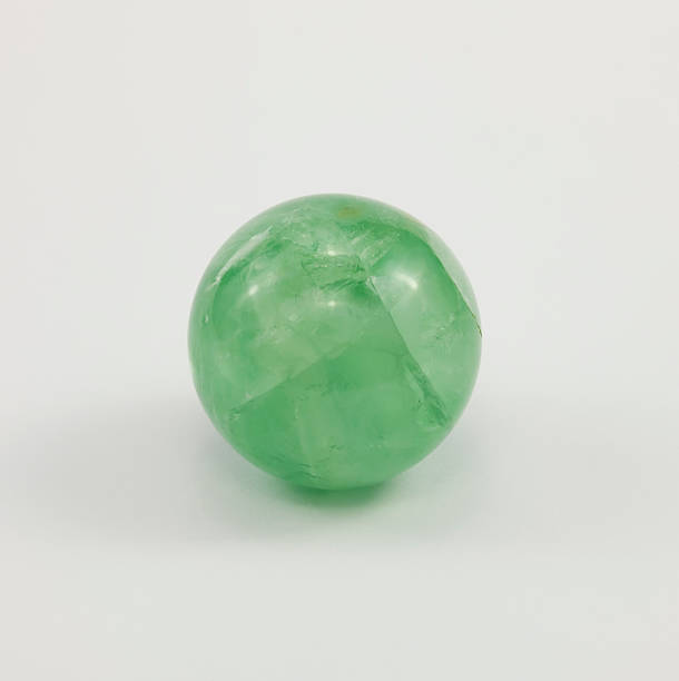 istock Small ball of fluorite, gemstone green. 497862792