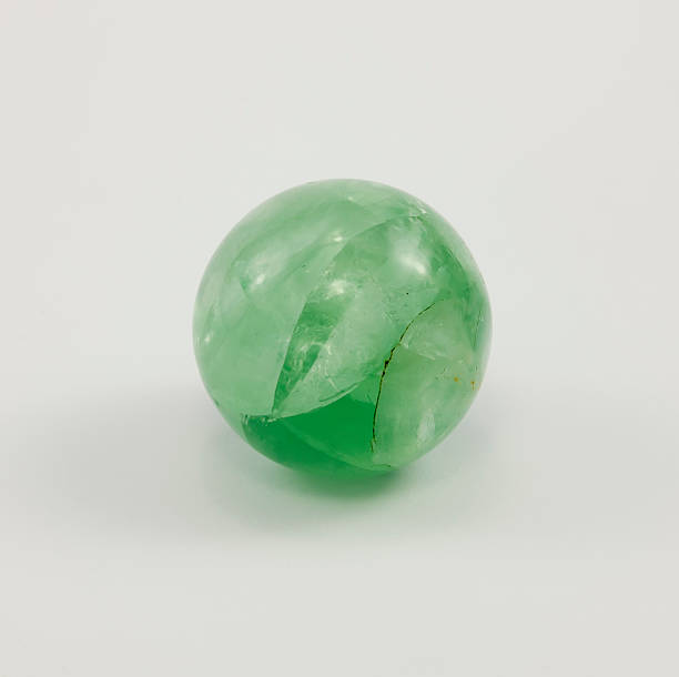 istock Small ball of fluorite, gemstone green. 497862832