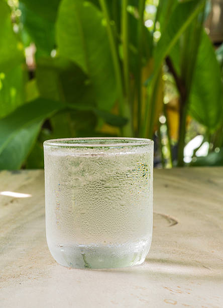 istock Glass cold water on wooden floor. 497863140