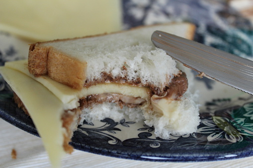 Bread with chocolate cream and cheese slices.