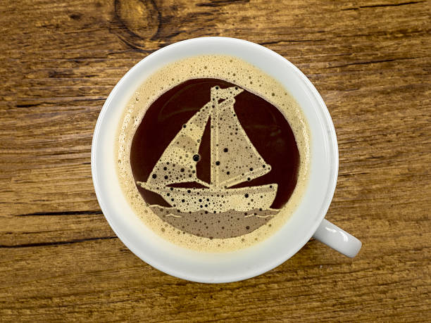 sailboat in the coffee cup stock photo
