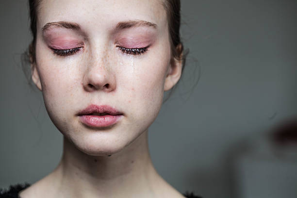istock beautiful young girl crying 497866528