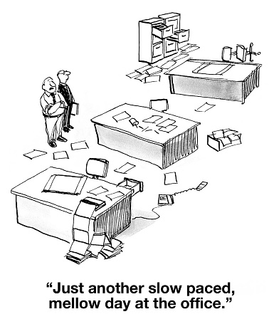 Business cartoon showing a very messy office.  Businessman says, 'Just another slow paced, mellow day at the office'.