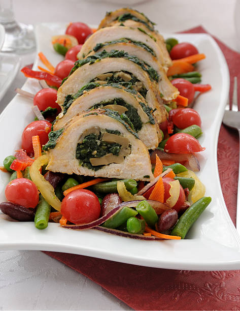 istock Chicken roulade with spinach and mushrooms with vegetables 497868946