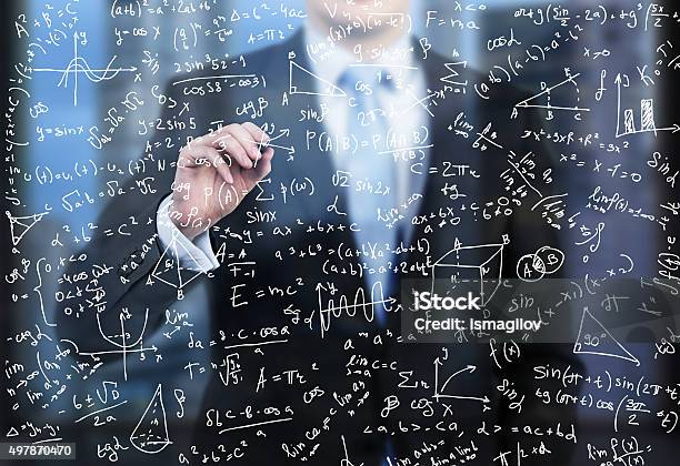 Business Person Is Writing Down Math Formulas Stock Photo - Download Image Now - Complexity, Glass - Material, Data