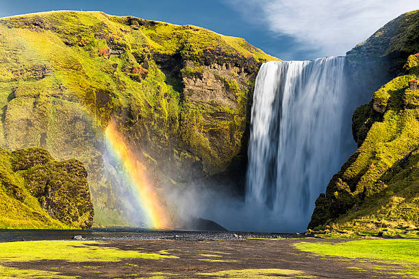 Front View of Iconic Skogafoss Waterfall, South Iceland, Rainbow Skogafoss Waterfall,  South Iceland, rainbow hraunfossar stock pictures, royalty-free photos & images