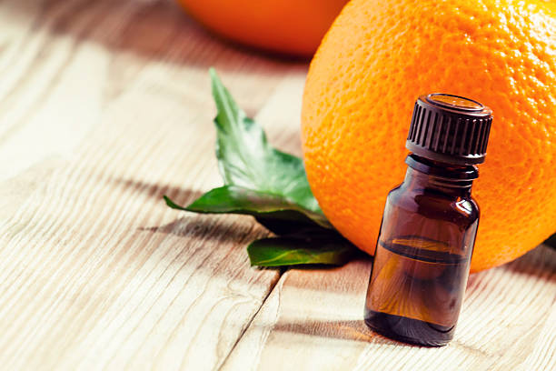 istock Orange oil in a small bottle and fresh fruit 497891906