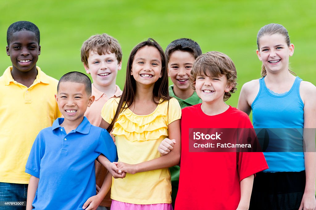 Kids having fun A group of diverse children playing outside. Child Stock Photo