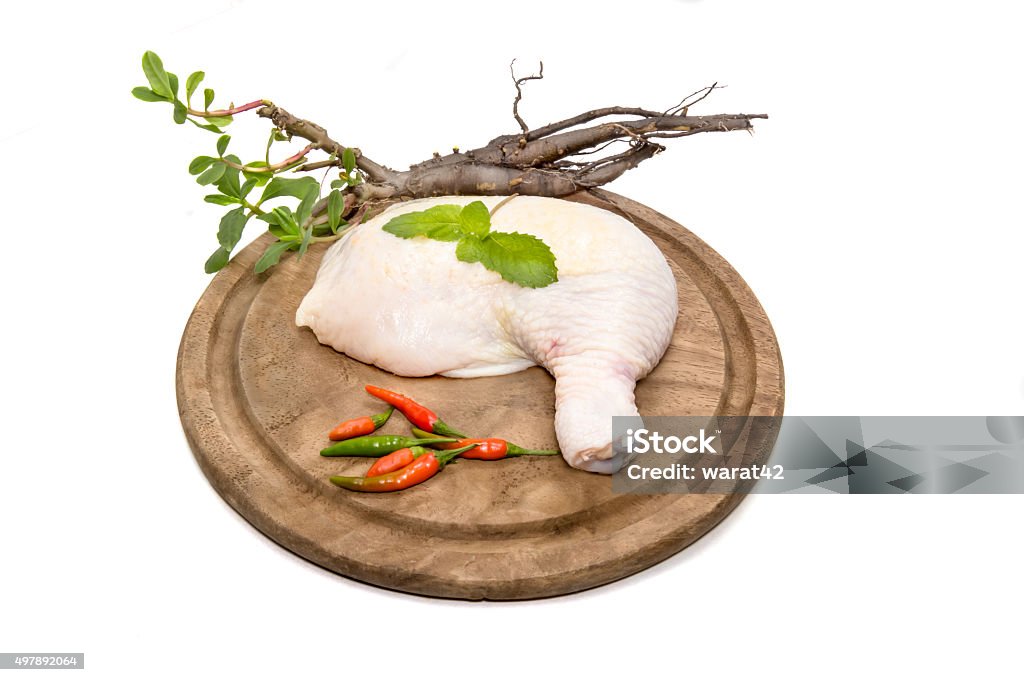 Raw Chicken Drumstick on cutting board Raw Chicken Drumstick on cutting board. 2015 Stock Photo