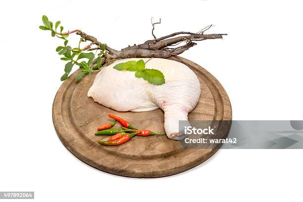 Raw Chicken Drumstick On Cutting Board Stock Photo - Download Image Now - 2015, Animal, Chicken Thigh - Meat