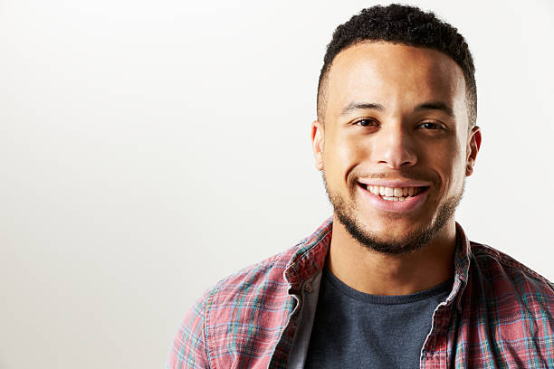 istock Studio Portrait Of Smiling Man Against White Background 497892682