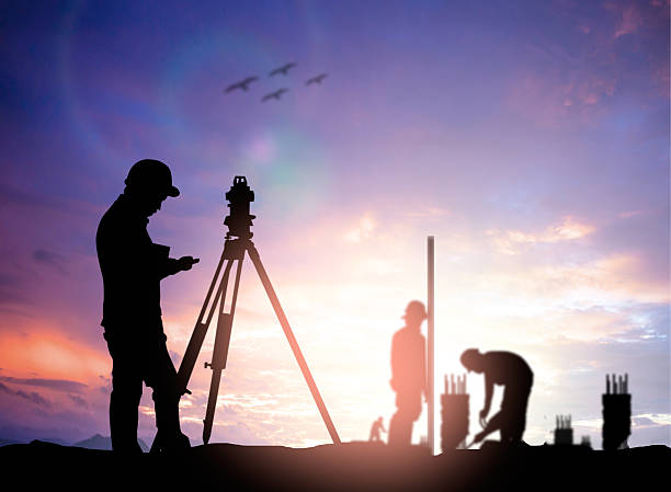 istock silhouette survey engineer working  in a building site over Blur 497892844