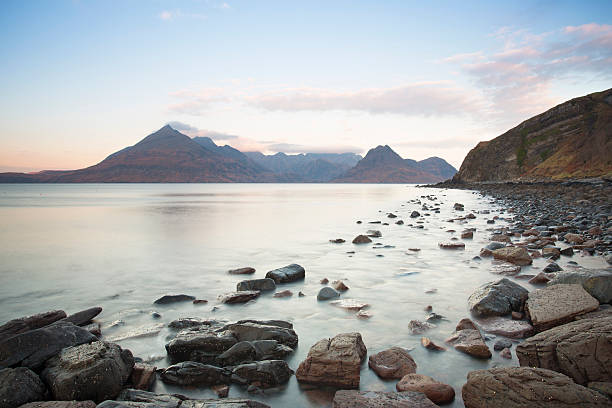 rocky shore an mountain landscape rocky shore looking towards sea and mountains in elgol,  isle of skye, scotland elgol beach stock pictures, royalty-free photos & images