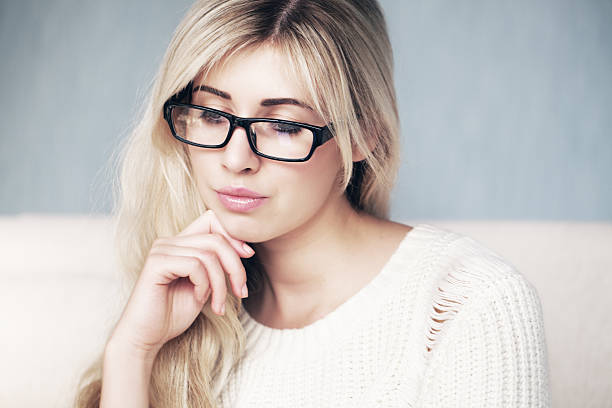 istock Blonde in classic glasses 497893986