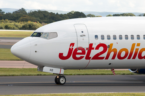 Manchester, United Kingdom - August 27, 2015: Jet2 Holidays Boeing 737 narrow-body passenger plane taxiing, Manchester International Airport.