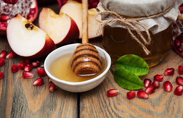 istock Honey with pomegranate and apples 497895510