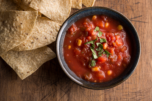 Fresh Salsa with Tortilla Chips on a rustic wooden background