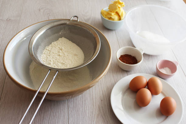 istock Baking, mixing bowl, flour sieve, eggs, cake, ingredients. 497896824