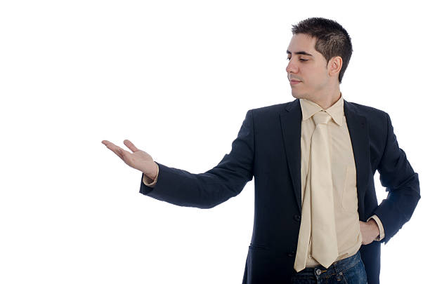 istock Man in business showing something with his right hand . 497898196