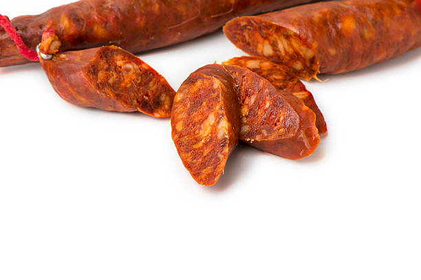 istock tasty sausage sliced  on isolated background 497901364