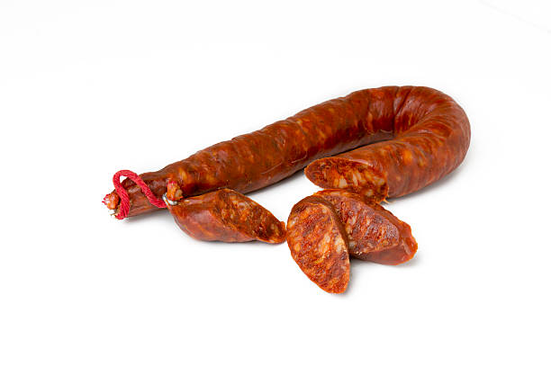 istock tasty sausage sliced  on isolated background 497901448