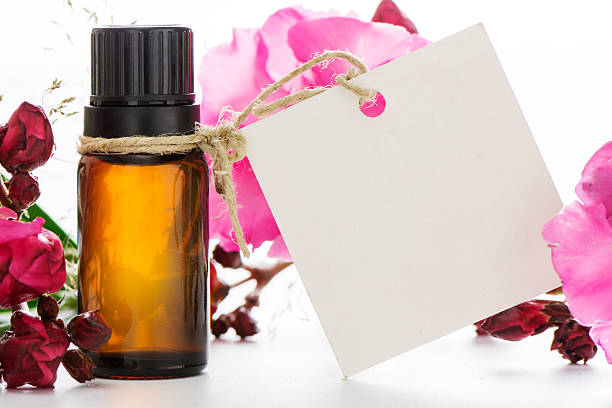 istock Essential oil, empty tags and roses flowers 497902286
