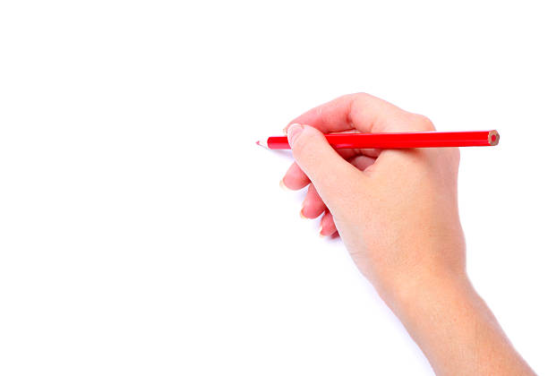 istock red pencil in hand  isolated white background 497903490