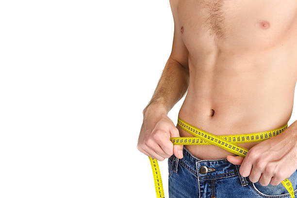istock Young man measuring her waist 497905752