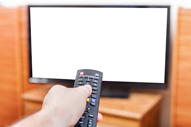 istock Hand switches TV channels with cut out screen 497906326