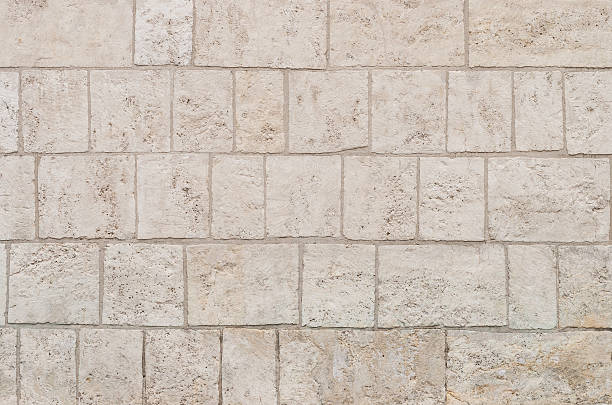 istock Old wall made of limestone bricks 497907030