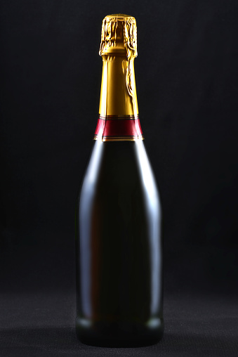 Champagne bottle isolated on black background