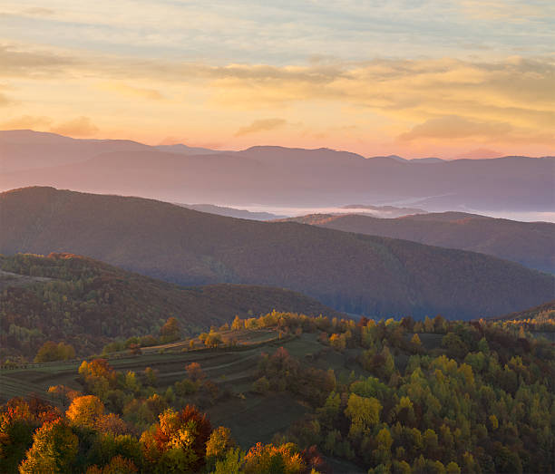 istock cold fog on hot sunrise in mountains 497934408