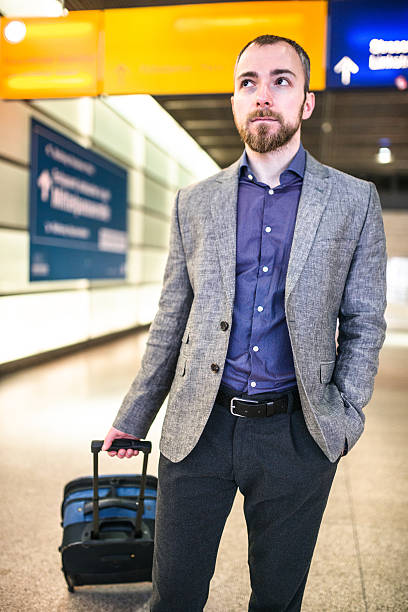 istock businessman waiting the train platform at the station 497935938