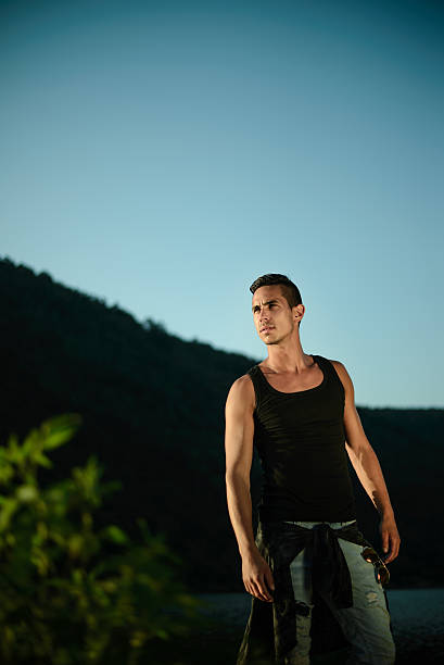 istock Man standing near lake 497938206