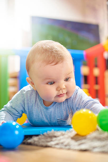 istock Young baby boy doing tummy time 497940498
