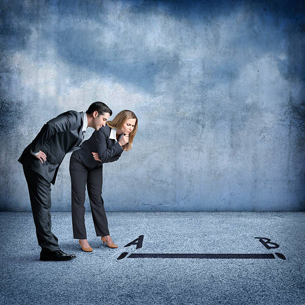 istock Businessman And Businesswoman Looking For Quickest Solution To Problem 497941196