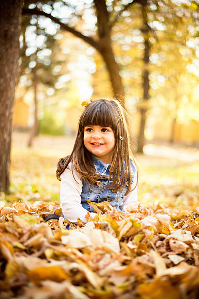 istock Girl sitting on leaves 497941436